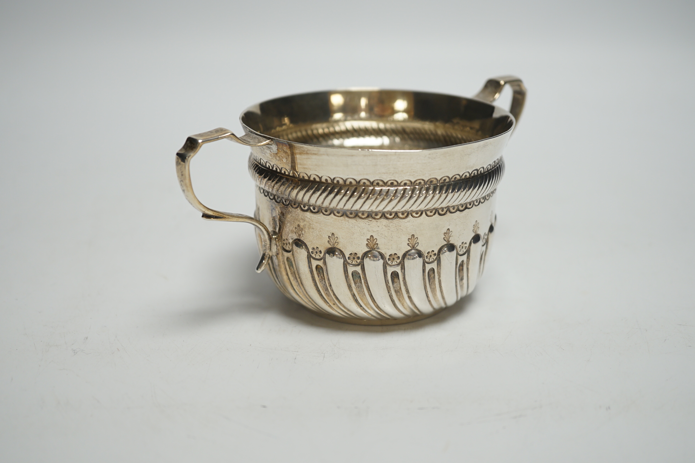 A late Victorian demi fluted silver porringer, John Septimus Beresford, London, 1886, 4.7oz.